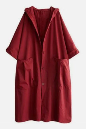 Oversized red water resistant windbreaker jacket with hood and front pockets