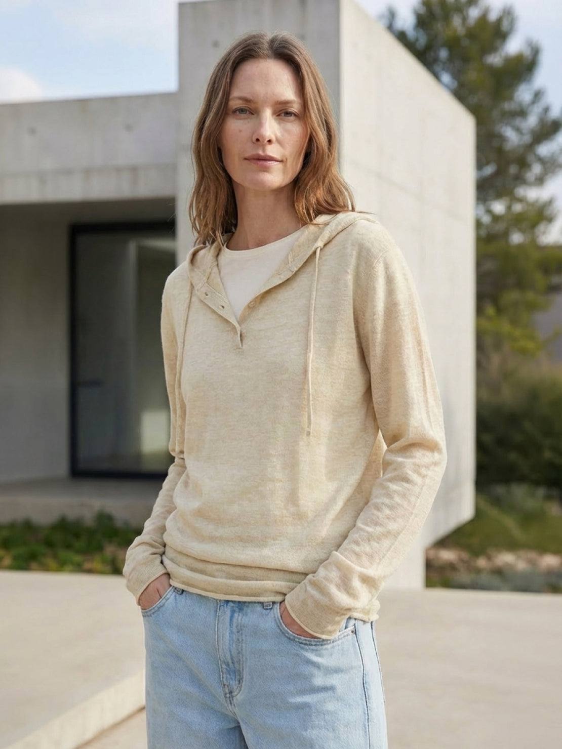 Lightweight organic linen Henley top with fine knit, relaxed fit, 3-button placket, long sleeves, and side slits.