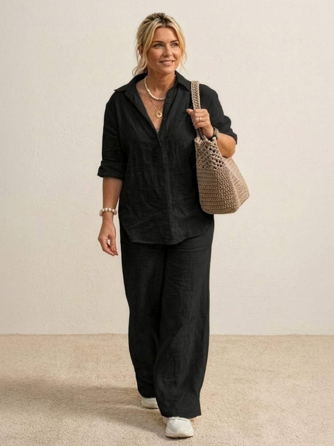 Woman wearing oversized 100 cotton black shirt and wide-leg pants co-ord set with relaxed fit and natural texture
