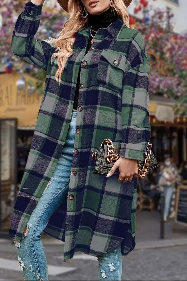 Woman wearing oversized medium-length blue plaid overshirt with jeans and black turtleneck outdoors