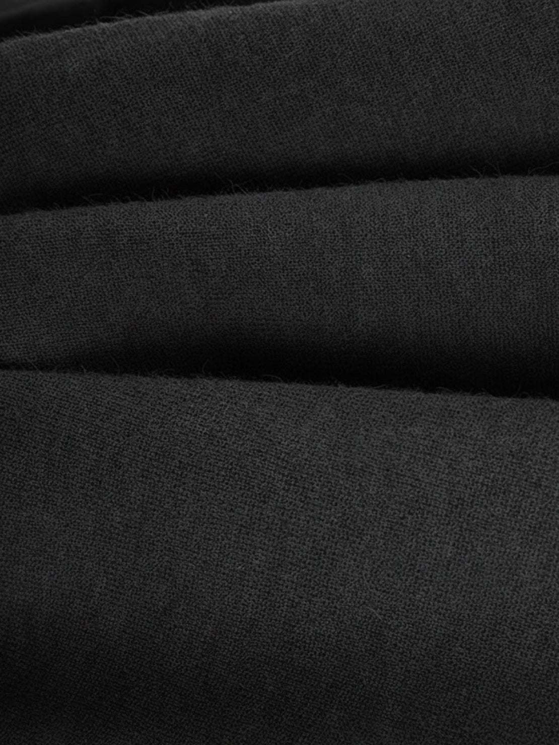 Close-up of soft black plush fabric texture for Plush & Preppy Camel Two-Piece Set