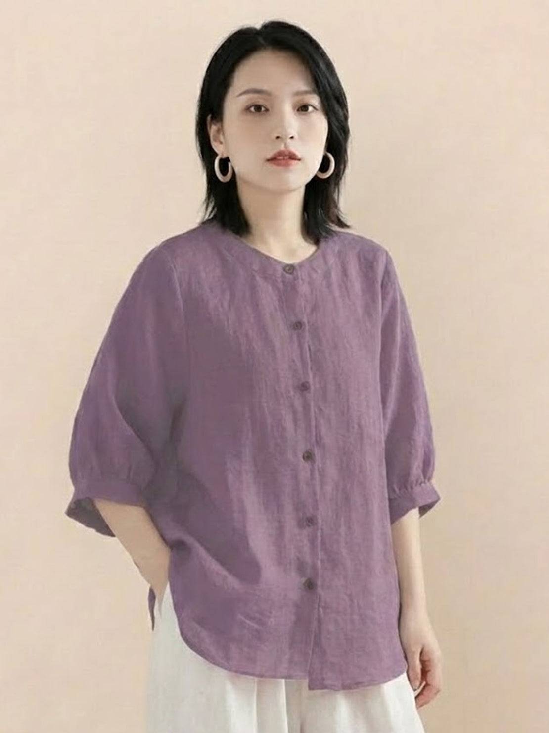 Relaxed loose breathable linen blouse in soft purple with button-down front and three-quarter sleeves