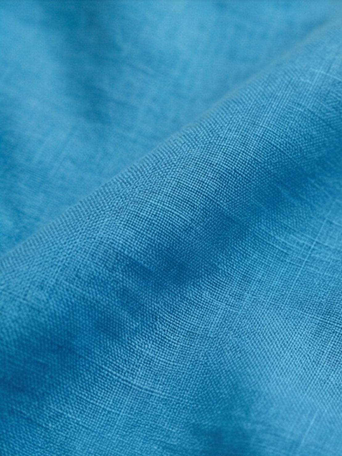 Woman wearing a relaxed shirt and trousers two-piece set in monochrome style