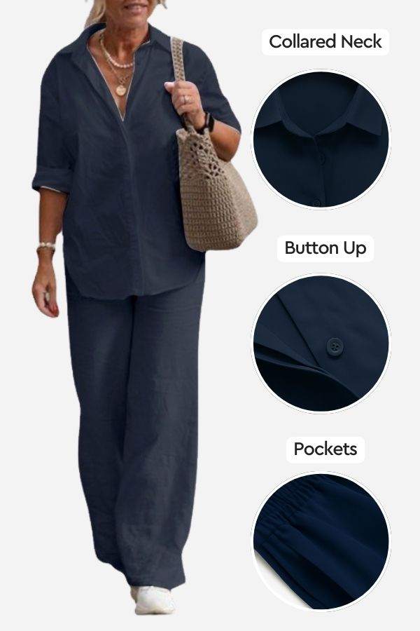 Woman wearing navy relaxed shirt and trousers two-piece set with collared neck, button-up front, and pockets, styled casually with a handbag.