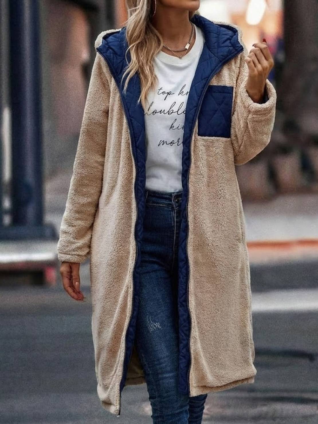 Women wearing beige sherpa-lined hooded teddy coat with navy quilted lining and pocket
