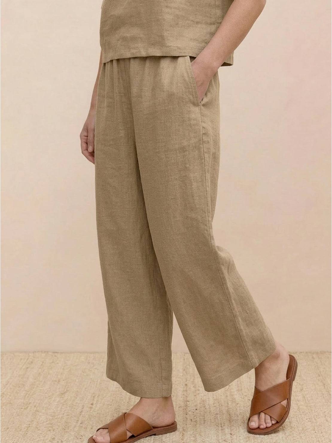 Woman wearing The Meadow loose fit co-ord set with soft-tailored top and wide-leg bottoms in solid color