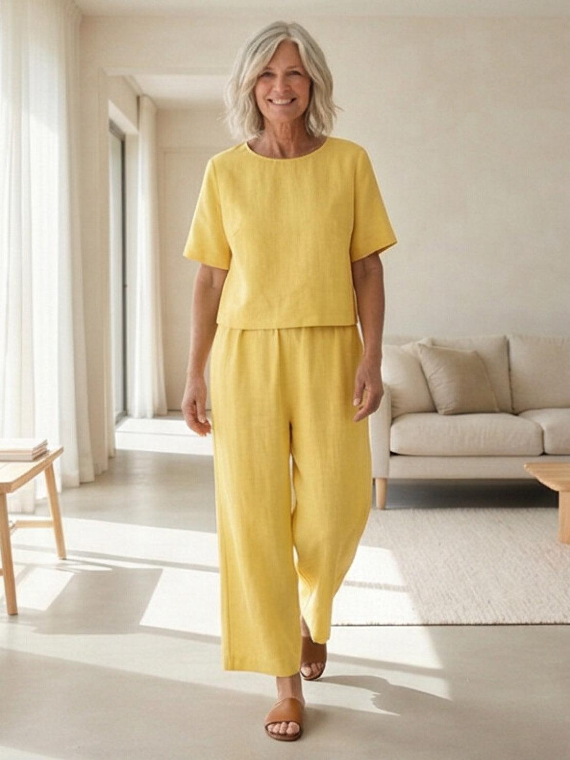 Woman wearing a soft-tailored loose fit co-ord set with relaxed top and wide-leg bottoms in solid color
