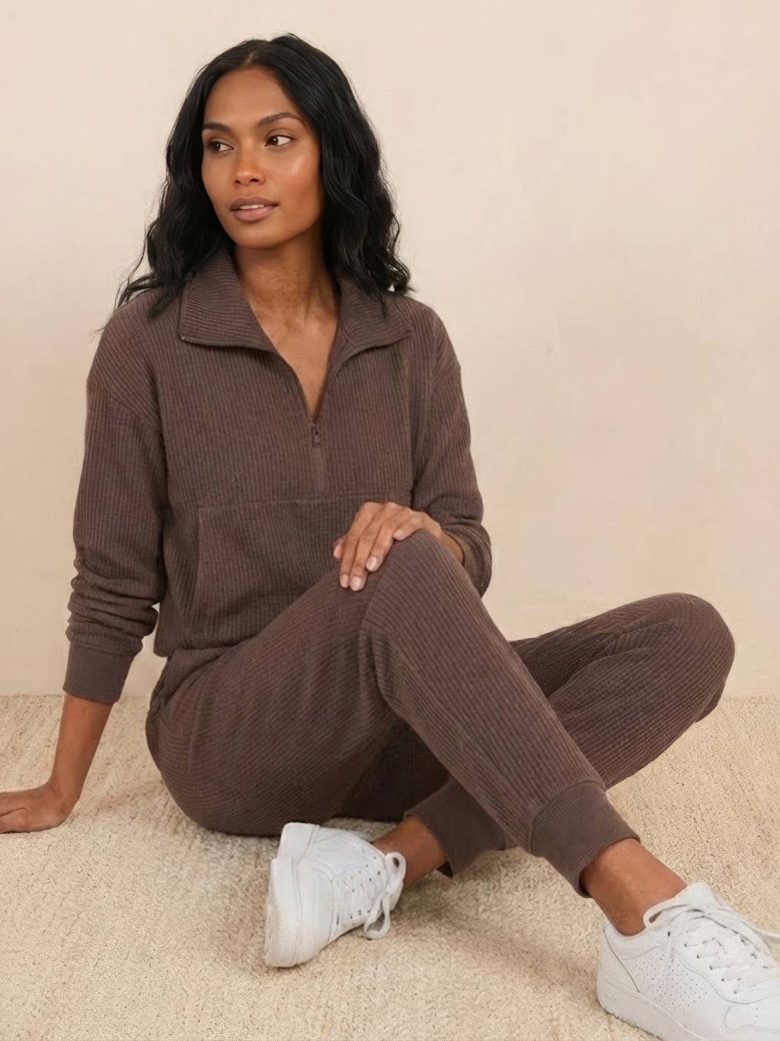 Unisex half-zip pullover and matching sweatpants set in soft polyester fabric for casual comfort and relaxed fit