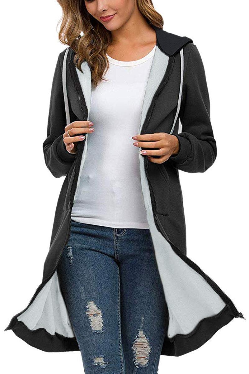 Black oversized long zip sweatshirt hoodie with fleece lining and hood, worn over white shirt and ripped jeans