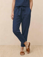 Cotton linen monochrome straight-leg pants with adjustable drawstring waist and breathable textured fabric