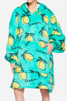 Snuggly oversized hooded fleece sweater with lemon print, soft double-layer fleece, large front pocket, and relaxed blanket fit