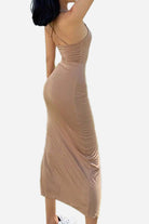 Elegant side slit midi dress in beige with flattering silhouette and thin straps