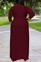Elegant plus size dress with belt in deep red featuring a swing skirt and 3/4 sleeves