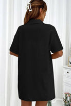Woman wearing black Sunny Day Vibrance two-piece set shirt viewed from the back