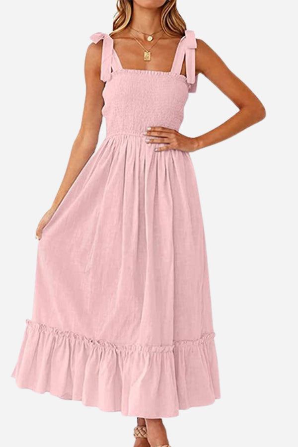 Pink Sunkissed Spaghetti Boho Dress with adjustable tie-up straps and flowy high-waist skirt
