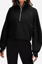 black cozy oversized half-zip fleece pullover sweatshirt with front pocket and long sleeves