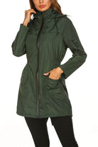 Outdoor and Travel Hooded Raincoat windbreaker jacket in green, lightweight and weather-resistant design with front zipper and pockets.