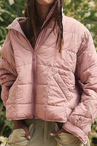 Lightweight puffer travel jacket compressible and stylish for versatile travel use