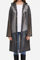 Chic Drizzle Defender transparent black raincoat with hood, button closure, and long sleeves