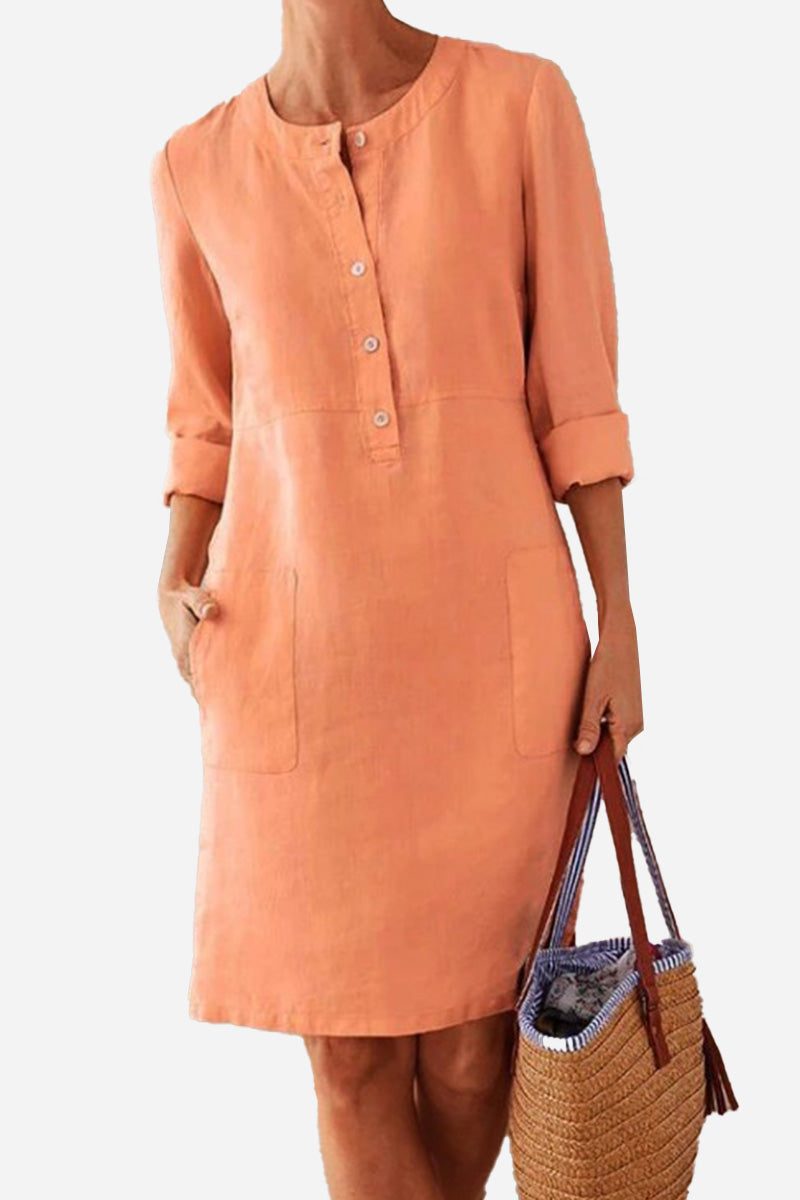 Women's lightweight cotton dress with rolled 3/4 sleeves and button front in peach color