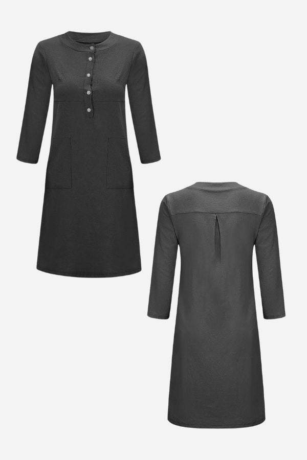 Front and back view of a knee-length black cotton dress with 3/4 sleeves and button detailing.