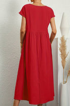 Red capped-sleeve voluminous pleated midi dress with loose sleeves and flowing skirt, back view