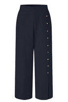 Navy blue wide leg pants with side buttons and high tailored waist, breathable cotton blend for comfort and style.