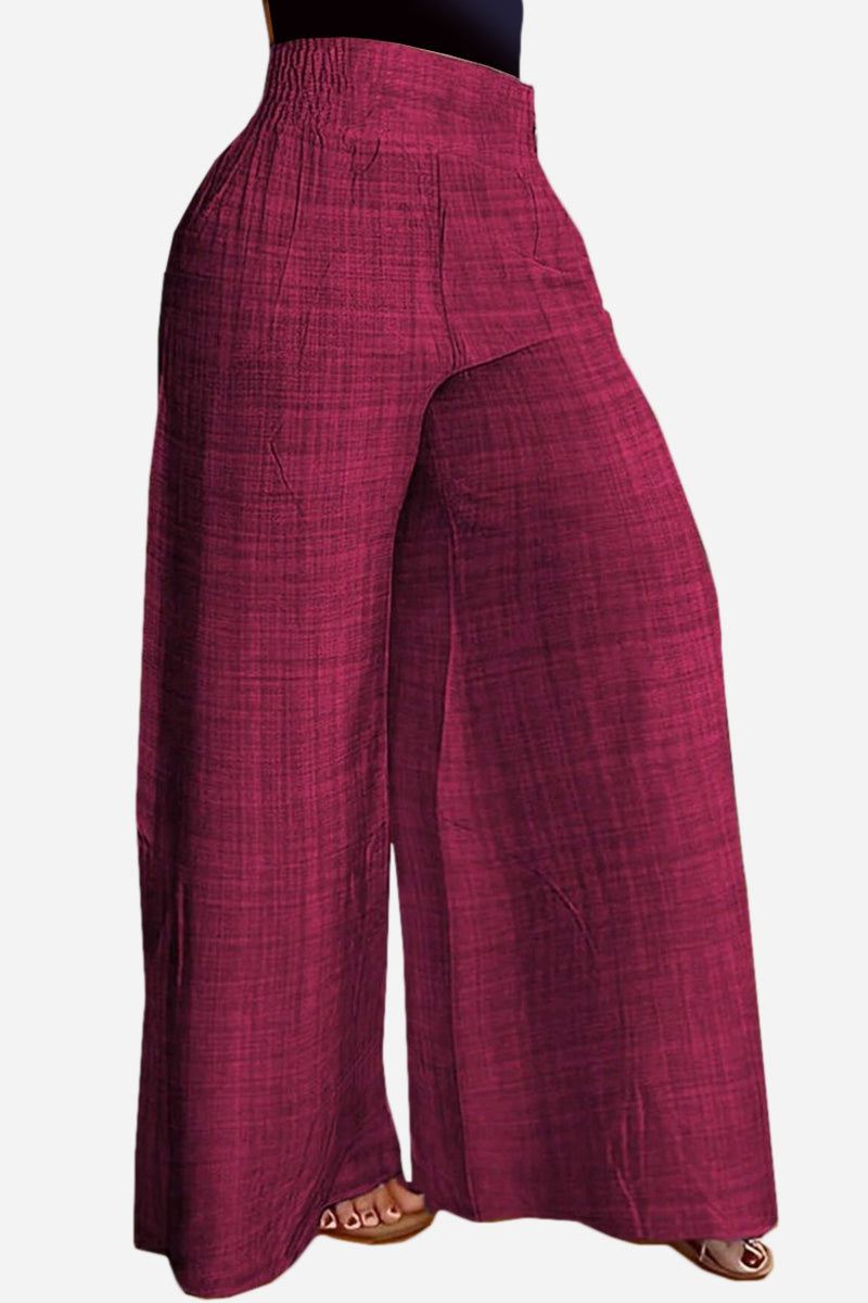 High waist wide leg pants in textured burgundy fabric with relaxed fit and elastic waistband