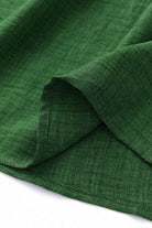 Close-up of green lightweight fabric for high waist wide leg pants