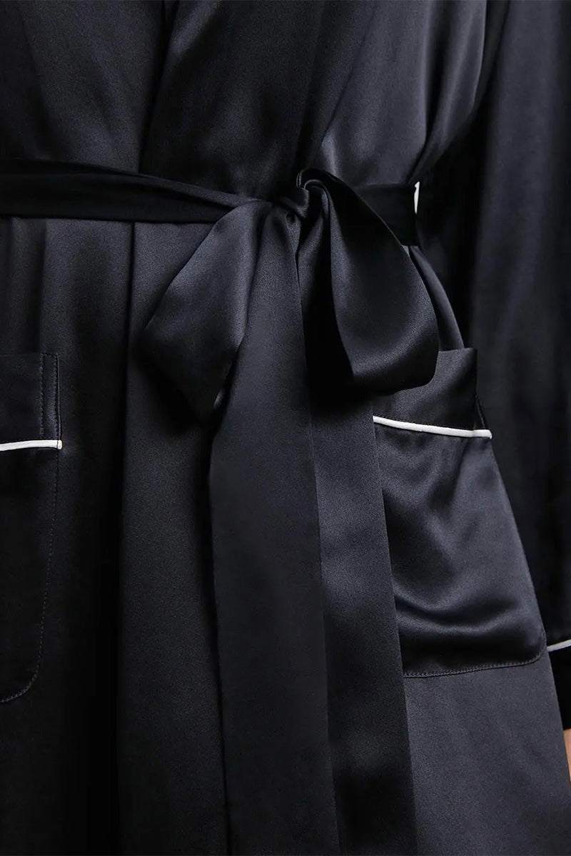 Close-up of black Mulberry Silk Nightgown with sash belt and pockets detailing