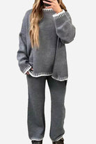 Chic contrast stitch gray travel set with white trim, comfortable knit top and pants for stylish travel wear