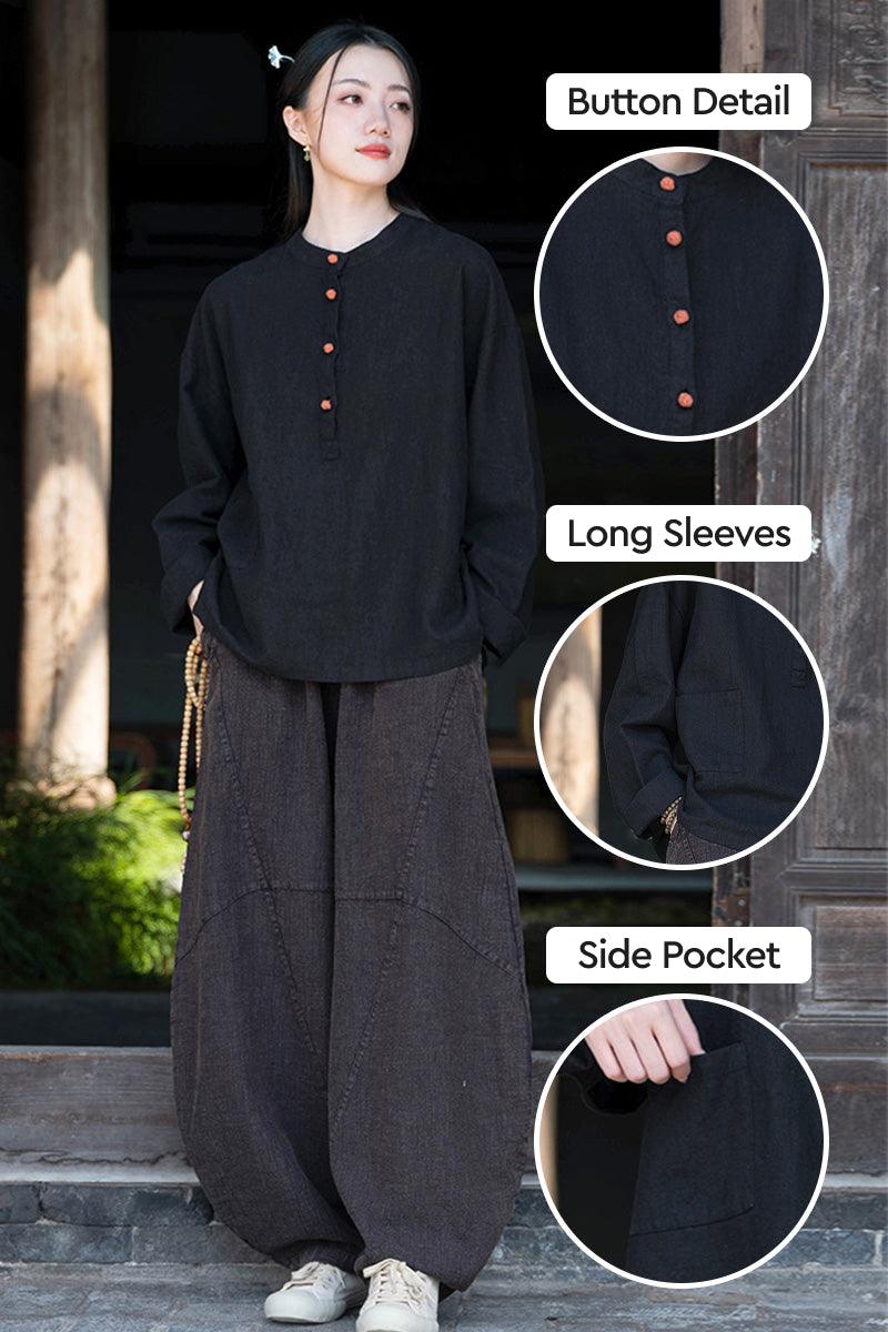 Black ramie linen and cotton blouse with long sleeves, button detail, and side pocket, styled with loose pants for a relaxed fit