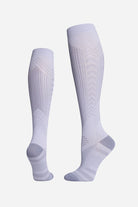 Light grey premium compression socks designed for travel with gradual compression and breathable fabric.