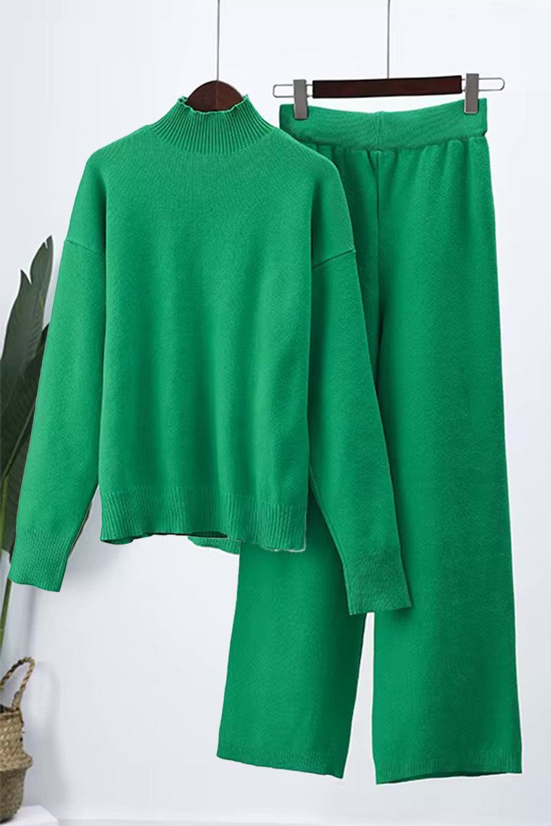 Green knitted turtleneck sweater and wide-leg pants two-piece set hanging on hangers