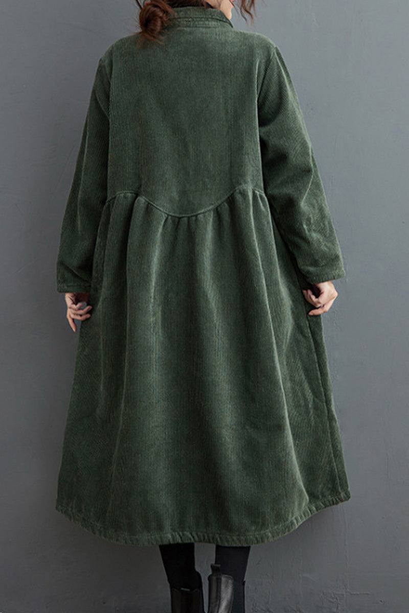 Back view of oversized vintage corduroy coat in dark green with a loose, flowing fit.