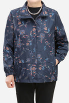 Plus size weathershield floral jacket with water-resistant and windproof fabric designed for comfort and travel.