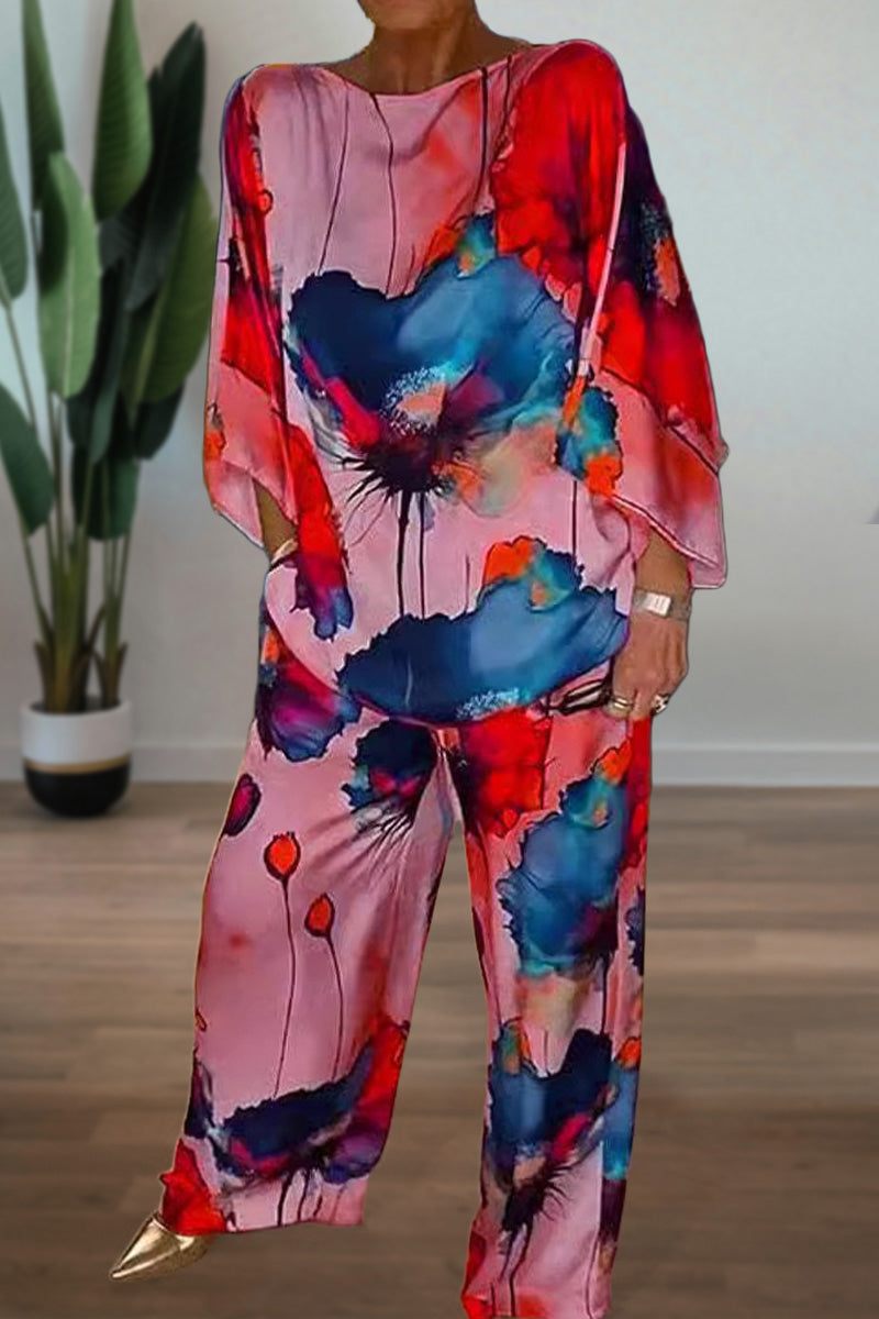 Plus size vibrant floral matching set with flowy silhouette in red, pink, and blue tones