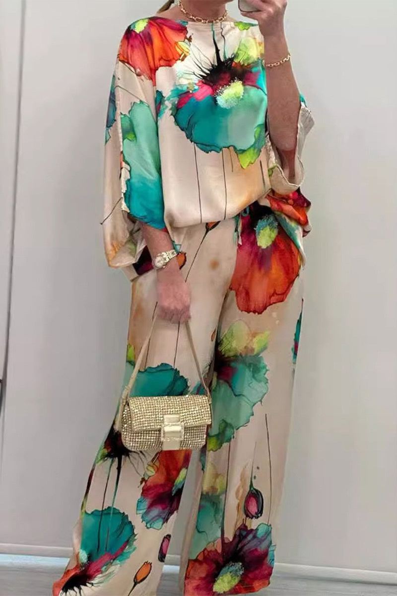 plus size vibrant floral matching set with colorful abstract flower prints on flowy top and pants