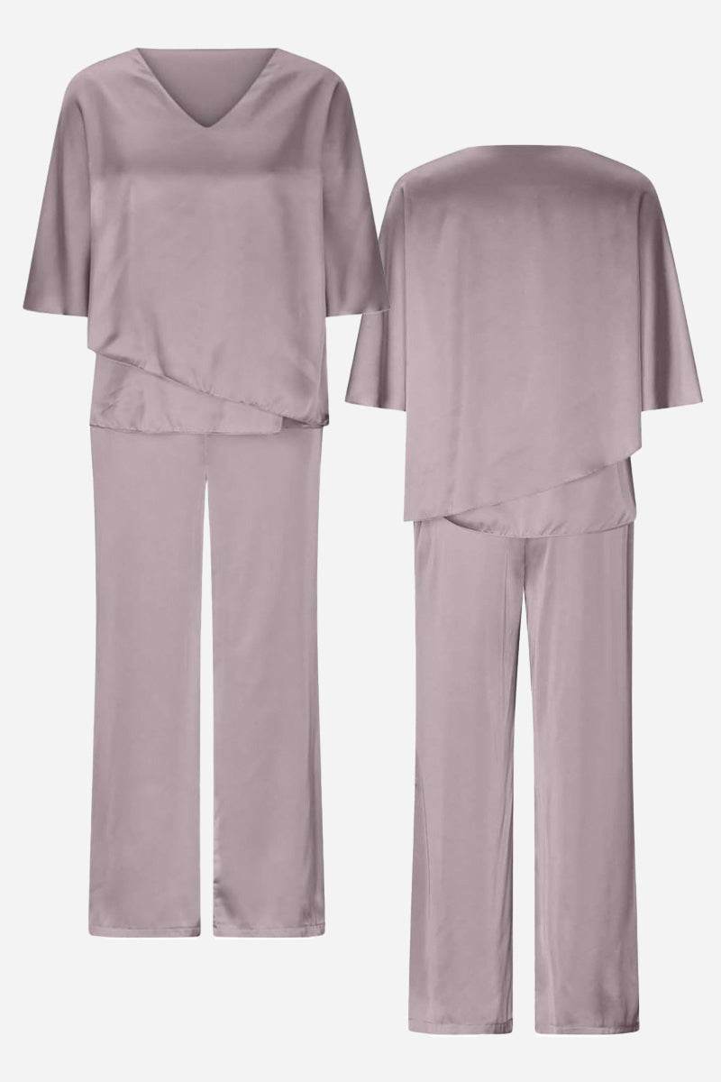Elegant Layers Two-Piece Set with layered V-neck top and comfortable pants in soft, wrinkle-resistant fabric.