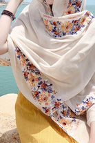 Lightweight embroidered travel-must shawl wrap with floral details and versatile wear styles