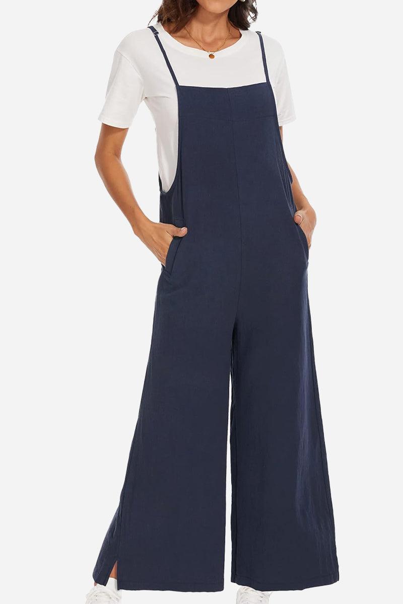 Navy cotton blend comfort jumpsuit with wide-leg design and adjustable straps, worn over white t-shirt.