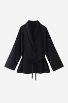 Black wide-leg pants and matching wrap top mix-match lounge-to-travel set for versatile stylish comfort.