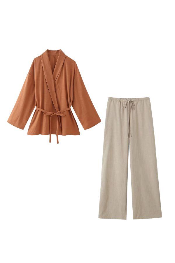 Women's mix-match lounge-to-travel set with rust wrap top and beige wide-leg pants.