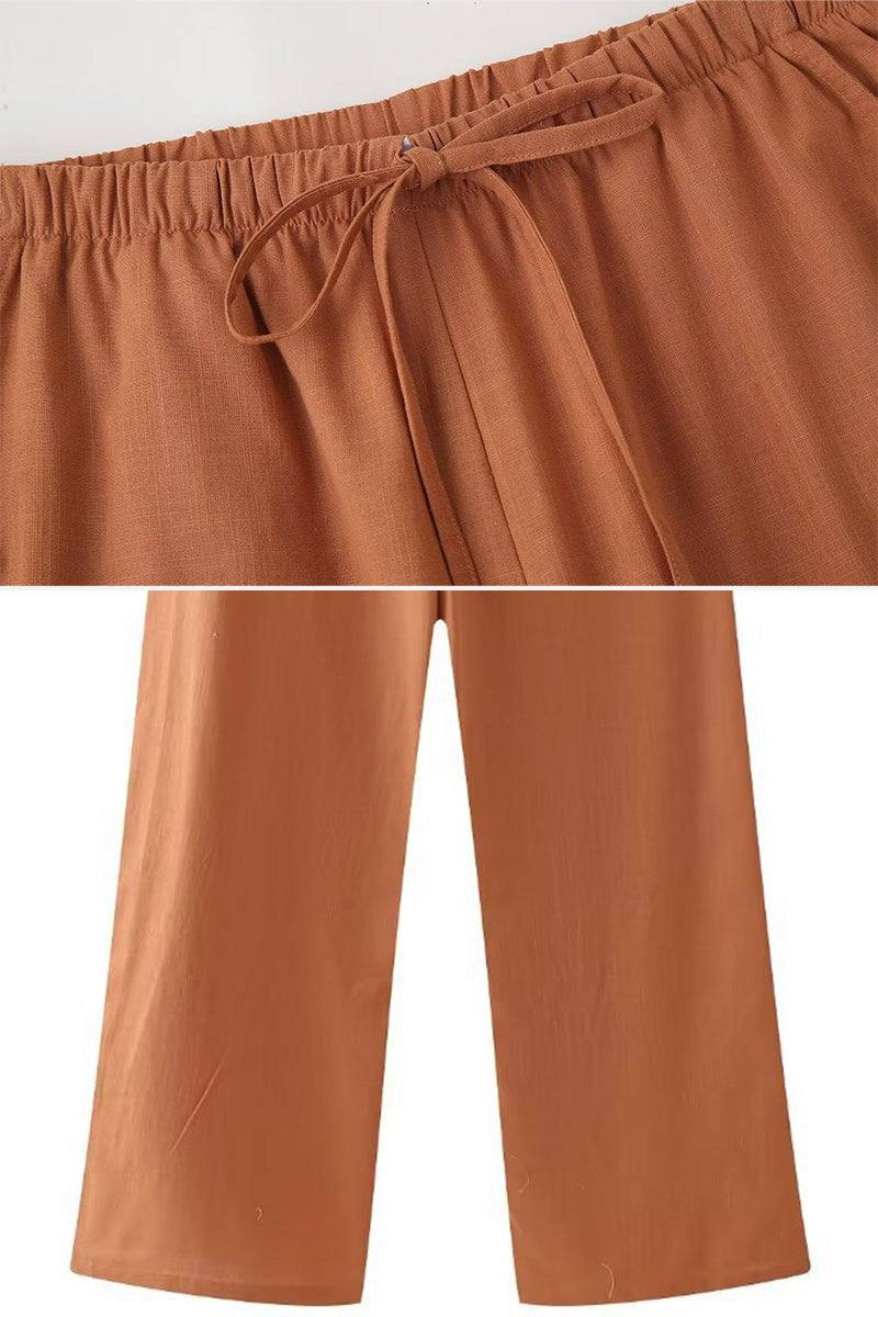 Rusty orange wide-leg pants from versatile Mix-Match Lounge-to-Travel Set with an elastic waistband and drawstring.