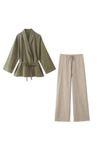 Mix-Match Lounge-to-Travel Set with wide-leg pants and belted top in earth tones, comfortable and stylish polyester fabric.