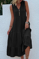 Bohemian tiered midi dress in black with V-neck and button detail, sleeveless summer dress with flowing tiers and empire waist.