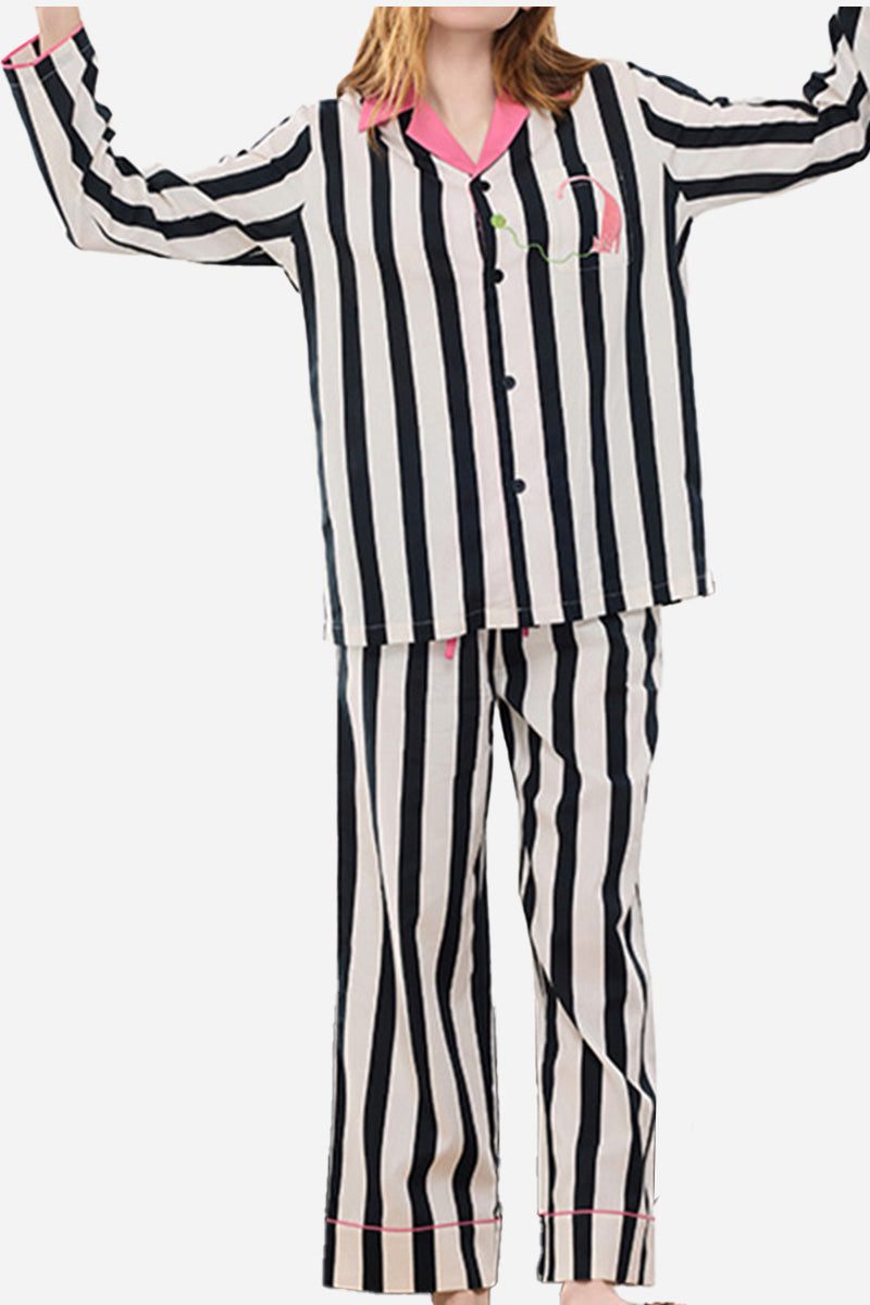 Woman wearing premium moisture-wicking cotton-tencel striped pajama set with pink trim