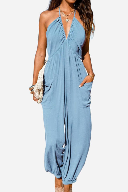 Sunshine On Sand blue halter-neck jumpsuit with ruched neckline and elastic ankle cuffs