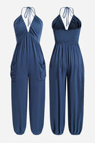 Sunshine On Sand navy blue halter-neck jumpsuit with ruched neckline and elastic ankle cuffs