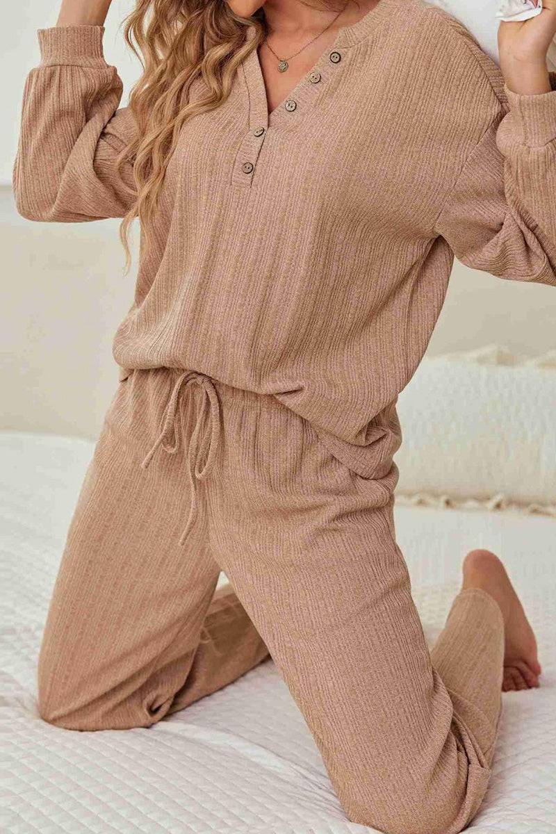 Woman wearing Desert Bloom Ribbed Comfort Set in soft ribbed fabric with button details, posing on bed.